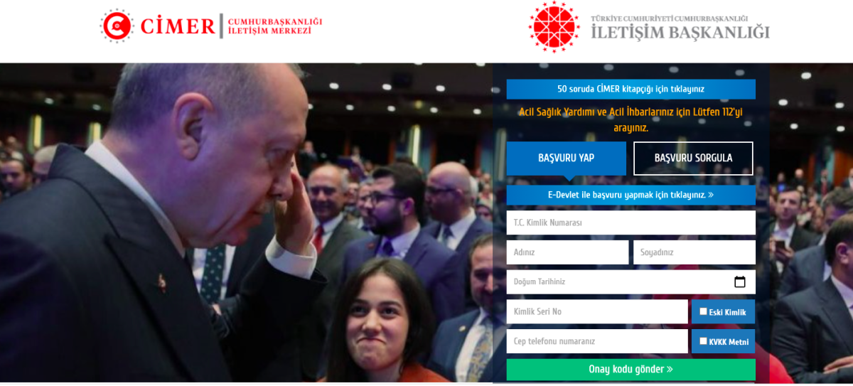 Bir el, bir cep telefonu tutuyor ve CİMER logosuna tıklıyor